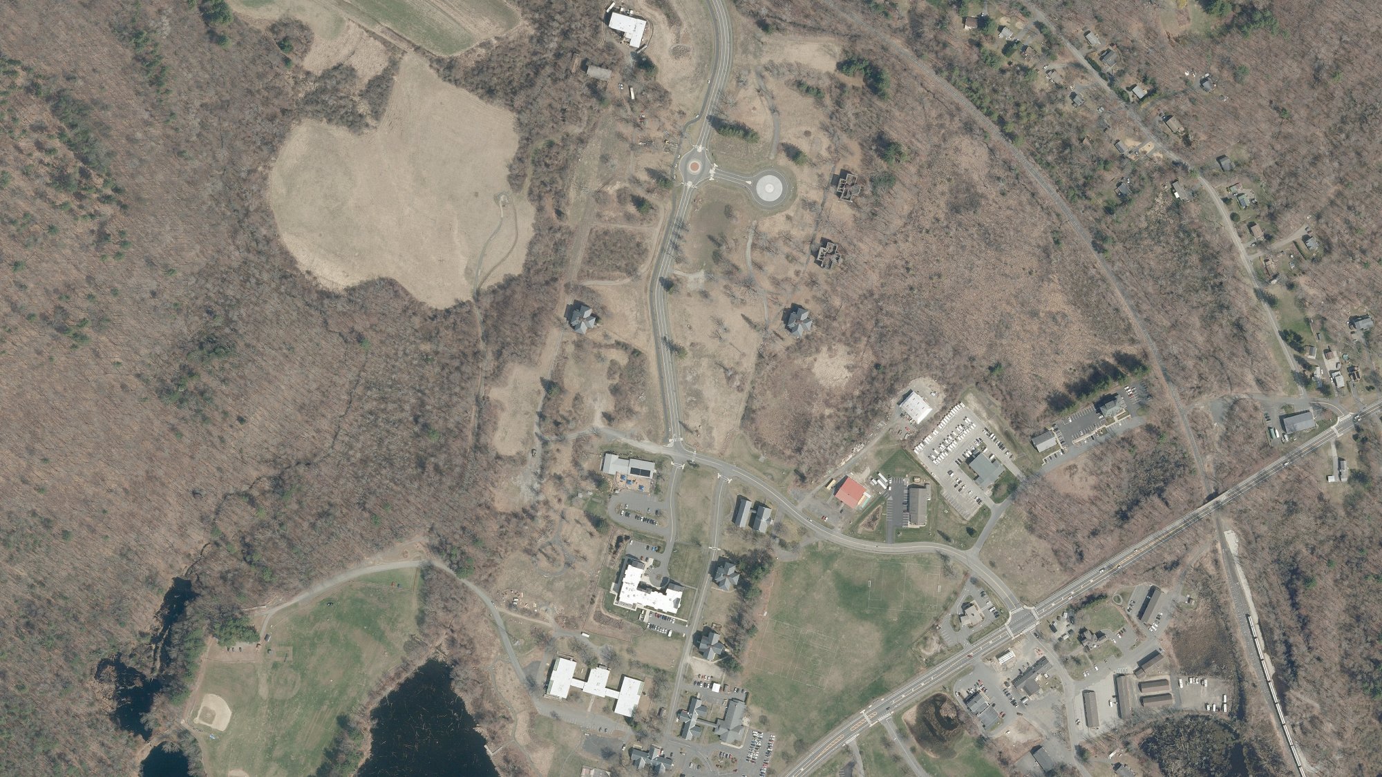 Spring 2025 aerial view of Carriage Grove and its surrounding landscape in Belchertown